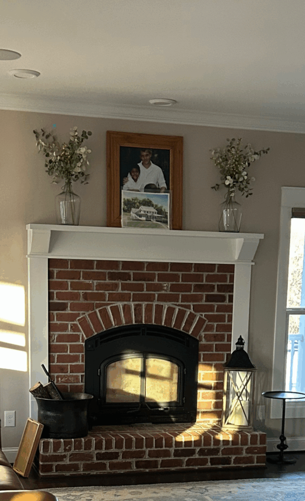 Canvas Interior room #3 redone, Milholin Living room fire place and mantel with a family picture on the wall.